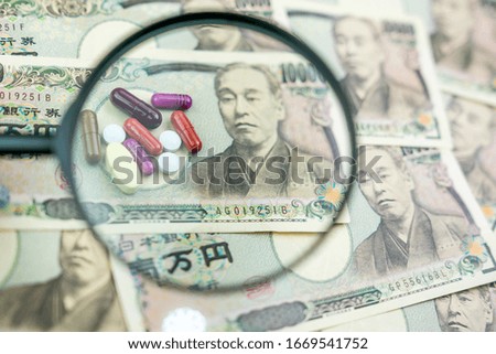 Close up of drugs, pills on the background made of Japanese Yen banknotes
