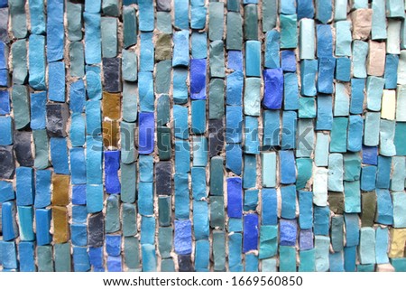 Sea texture of stones. Mosaic of bricks random various shapes and colors. Turquoise, blue and blue mineral. Calm neutral composition for background and decoration. Place for text. Theme of leisure.