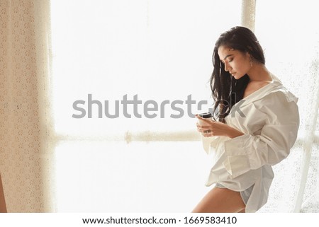close up asian woman artist in white shirt drinking coffee and relax (woman lifestyle concept)