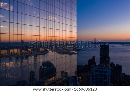 Aerial view of New York city Manhattan skyline with Three world trade center at dusk.
