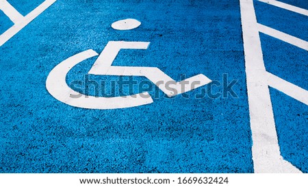 a handicap parking space with blue and white