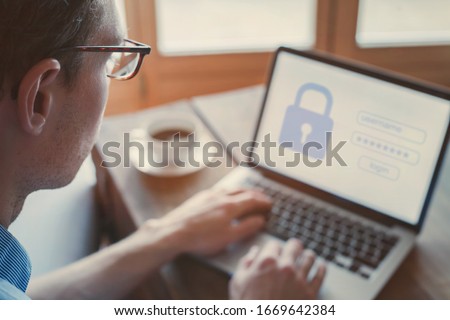 data protection and internet security concept, user typing login and password on computer, secured access Royalty-Free Stock Photo #1669642384