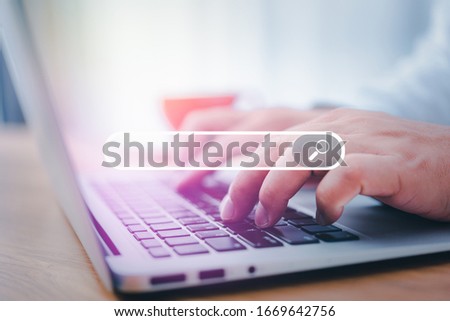 Hand man using laptop for Searching Browsing Internet Data Information Networking Concept.