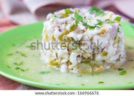 Tartar ceviche of raw white fish with olives, lemon, sauce, capers, onions, parsley, gourmet appetizer