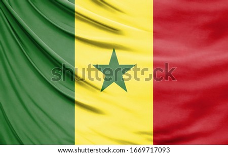 Realistic flag of Senegal on the wavy surface of fabric