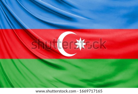 Realistic flag of Azerbaijan on the wavy surface of fabric