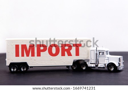 IMPORT word written on board a truck trailer