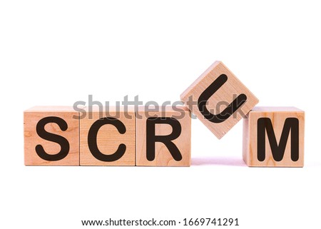 SCRUM word concept written on a light table and light background