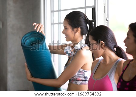 Group of sportive people in a gym training - Multiracial group of athletes  stretching body workout session yoga class