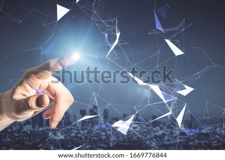 Hand using blue creative polygonal background with city view. Communication and teamwork concept. Close up