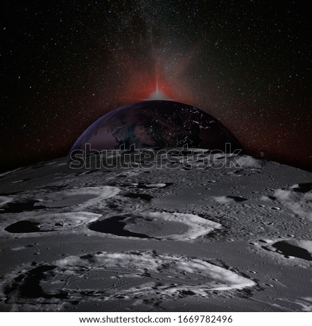 Planet Earth rises above the surface of the Moon, dotted with craters, and the sunlight behind. Elements of this image furnished by NASA. Royalty-Free Stock Photo #1669782496