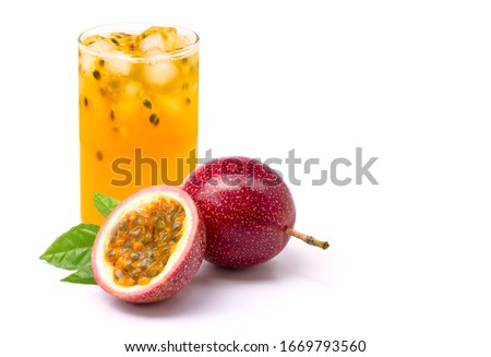Closeup glass of passionfruit ( maracuya ) juice with passion fruit half slice and green leaf isolated on white background. Healthy drinks concept. Royalty-Free Stock Photo #1669793560