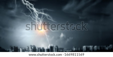Lightning bolt at a dark night Royalty-Free Stock Photo #1669811569