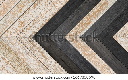 Black and white wooden floor with herringbone pattern.