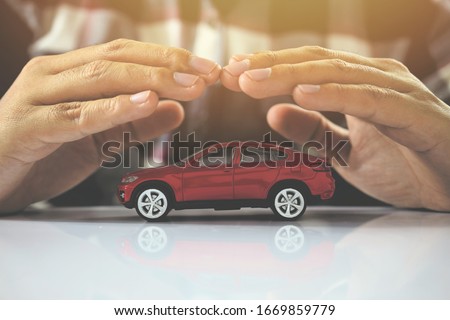 Male hands and car as protection of car concept Royalty-Free Stock Photo #1669859779
