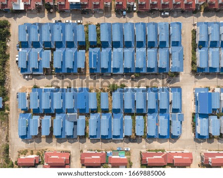 Aerial view of a Housing Estate village landscape by drone.residential roofs architecture decoration.Urban aerial houses building neighborhood drone shot