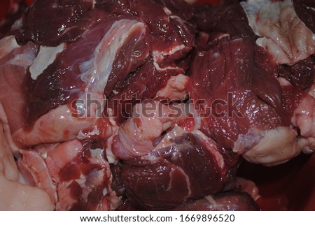 Close-up of raw meat. Red raw meat. Meat while preparing. Fatty meat. 