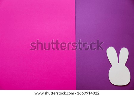 A pink and purple background with bunnies in the corner. There is room for your text.