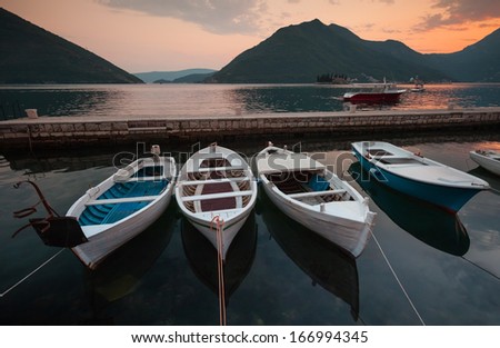 Fishing boats float moored in Perast port. Bay of Kotor, Montenegro