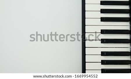 
Keyboard detail with headphones on red and yellow background