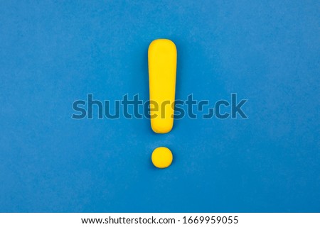 Vivid exclamation mark on blue background. Warning, keep attention concept. Royalty-Free Stock Photo #1669959055