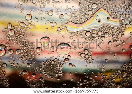 Abstract colorful Background Oil in Water surface Foam of Soap with Bubbles macro shot close-up
