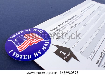 Absent voter ballot application. I voted by mail ￼sticker. Absentee forms.￼ Royalty-Free Stock Photo #1669980898