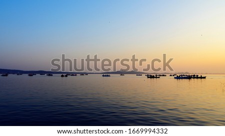 This is a picture of the sunset on Rawal Lake, Islamabad. People from around the country enjoy boat riding and sunset. It is a famous picnic park as well.