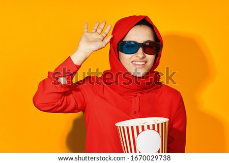 young woman with popcorn isolated background