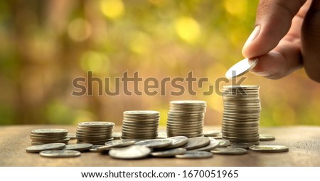 Save money. Business growth. concept finance and accounting. Stacked coins.