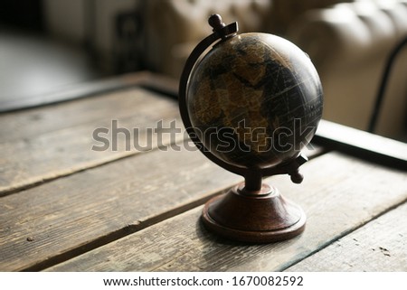 old craft Globe on wood table 