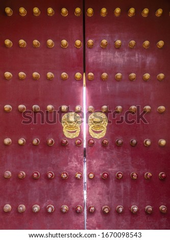 Chinese Temple Wooden Red Door with Golden knobs Royalty-Free Stock Photo #1670098543