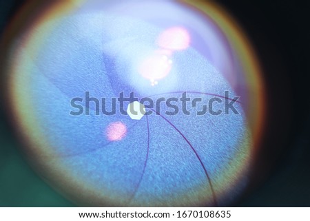 Beautiful camera lens with blue light of glass. Background pattern for design.	