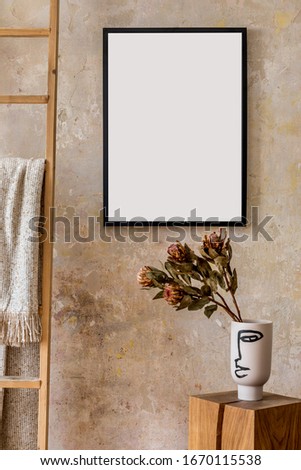 Modern composition of living room interior with black mock up poster frame, wooden cube, flowers in vase, ladder and elegant personal accessories in stylish home decor. 