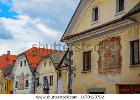 Historical old houses in the center of Radovljica town, Slovenia. Painted walls and Josipina Hocevar monument. Radovljica is a popular tourist attraction near famous Bled Lake