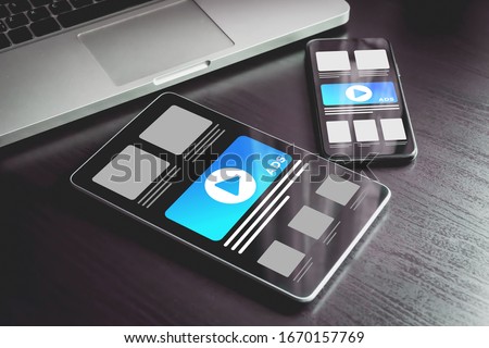 Online advertising on mobile devices. Targeted advertising and marketing industry ads effect concept. Smartphone and tablet pc with programmatic advertising, cross targeting ads on the screen. Royalty-Free Stock Photo #1670157769