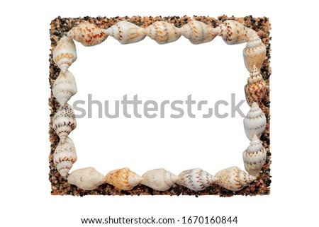 Photo frame made of shells and small stones with an empty space inside.