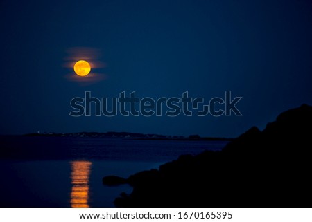 Worm Moon over the ocean 2020 in New England: Salem Massachusetts