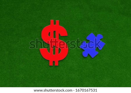 The dollar sign is red, the piece of the puzzle on a green background. Business, financial transactions.