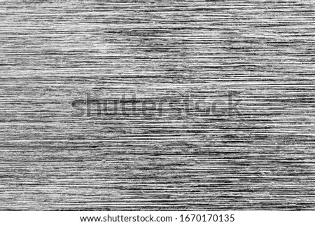 Gray monochrome metal texture with white scratches. Abstract noise black background overlay for design. Art stylized baner.