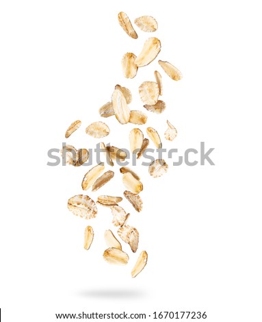 Oat flakes frozen in the air, isolated on white background Royalty-Free Stock Photo #1670177236