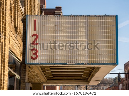 Blank movie cinema billboard or marquee sign in typical USA High street in downtown city