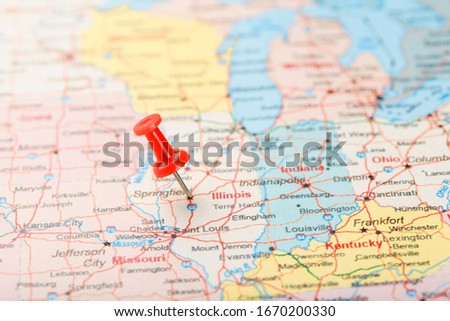 Red clerical needle on a map of USA, Illinois and the capital Springfield. Close up map of Illinois with red tack