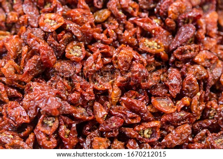 dried cherry tomatoes on the counter at the market