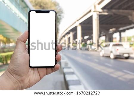 Asian man holding phone mock up left frame show application transportation take to destination isolated display for insert screen