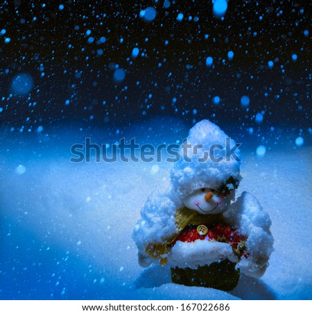 Art Greeting card with snowmen and snowfall 