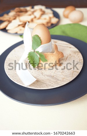        
Easter-style serving - egg decorated with a ribbon with bunny-shaped cookies                        