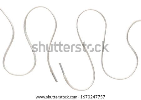 two long curved white shoe laces isolated on white background Royalty-Free Stock Photo #1670247757