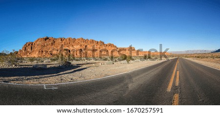 Panoramic picture of deep red colored rock formations in the Valley of Fire state park near Las Vegas in winter