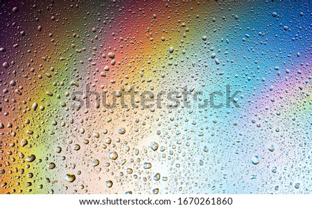 Abstract drops on a rainbow, can be used as a background. Concept, abstract art